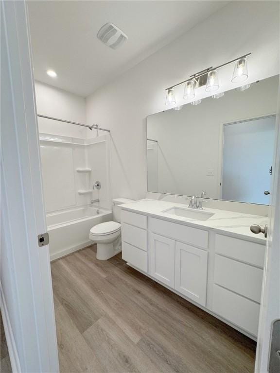 130 Broad Oak Dr, Rockport, TX 78382 - full bath featuring vanity, wood finished floors, and bathing tub / shower combination