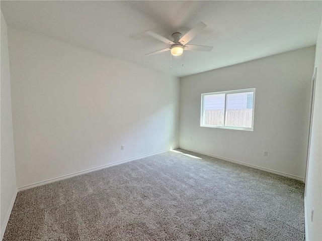 130 Broad Oak Dr, Rockport, TX 78382 - carpeted empty room featuring a ceiling fan and baseboards