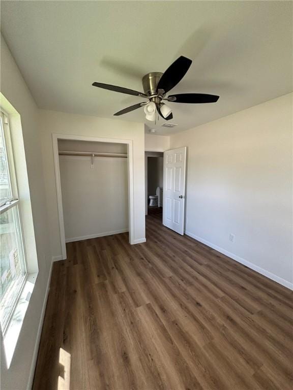 4342 Amherst Dr, Corpus Christi, TX 78412 - unfurnished bedroom with a closet, dark wood-style floors, and a ceiling fan