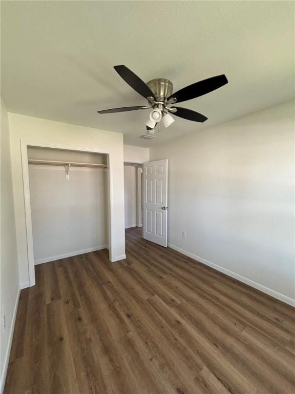4342 Amherst Dr, Corpus Christi, TX 78412 - unfurnished bedroom with a closet, dark wood-style floors, and ceiling fan