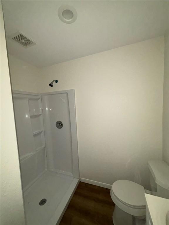 4342 Amherst Dr, Corpus Christi, TX 78412 - full bathroom with wood finished floors, vanity, and a shower