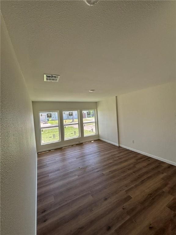 4342 Amherst Dr, Corpus Christi, TX 78412 - empty room with dark wood-style flooring and baseboards