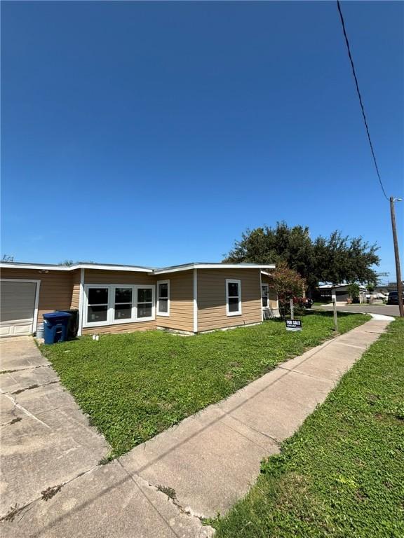4342 Amherst Dr, Corpus Christi, TX 78412 - view of front of house featuring a front lawn and concrete driveway