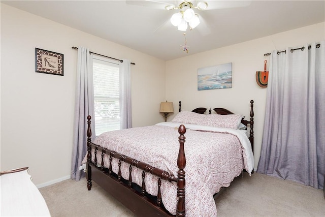 10639 Emmord Loop, Corpus Christi, TX 78410 - bedroom with light carpet, ceiling fan, and baseboards