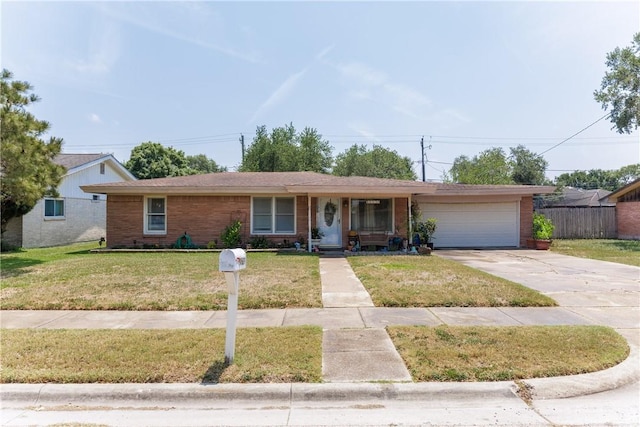 10639 Emmord Loop, Corpus Christi, TX 78410 - view of front facade featuring brick siding, a garage, and concrete driveway