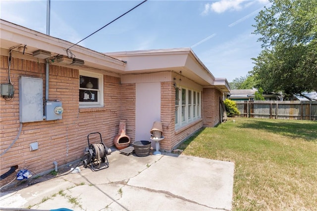 10639 Emmord Loop, Corpus Christi, TX 78410 - rear view of property featuring a patio area and brick siding