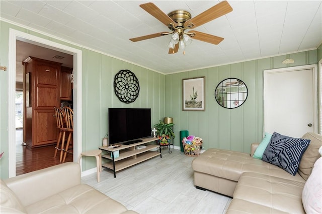 10639 Emmord Loop, Corpus Christi, TX 78410 - living room with crown molding, a ceiling fan, and wood finished floors
