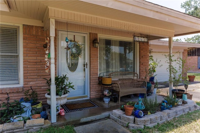 10639 Emmord Loop, Corpus Christi, TX 78410 - entrance to property with covered porch, brick siding, and a garage