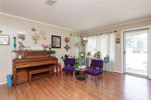 10639 Emmord Loop, Corpus Christi, TX 78410 - sitting room with wood finished floors, ornamental molding, healthy amount of natural light, and baseboards