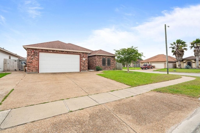 ranch-style house with a front yard, roof with shingles, brick siding, an attached garage, and driveway