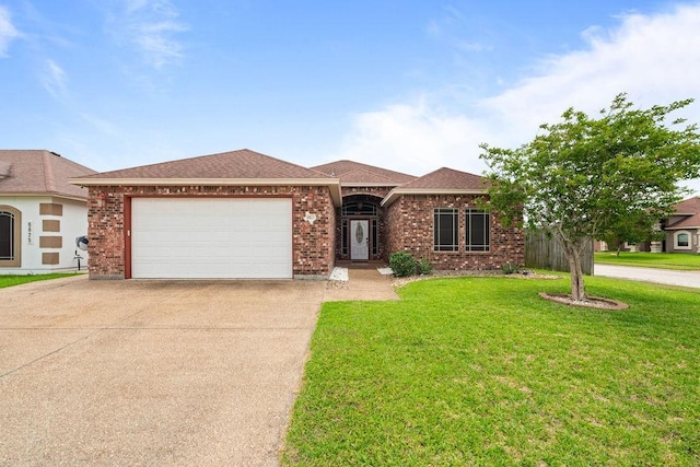 ranch-style house featuring brick siding, an attached garage, driveway, and a front lawn
