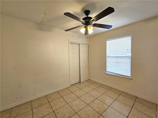 4318 Ivy, Corpus Christi, TX 78415 - empty room featuring light tile patterned floors, ceiling fan, and baseboards