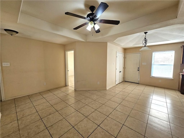 4318 Ivy, Corpus Christi, TX 78415 - empty room with a tray ceiling, light tile patterned floors, baseboards, and ceiling fan