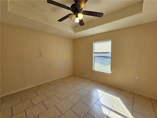 4318 Ivy, Corpus Christi, TX 78415 - empty room featuring a tray ceiling, light tile patterned floors, baseboards, and ceiling fan