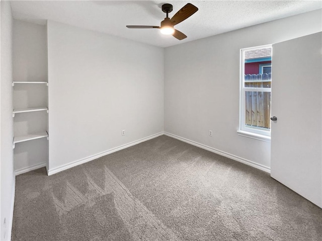 2613 Raintree Trl, Ingleside, TX 78362 - carpeted empty room with baseboards, a textured ceiling, and a ceiling fan