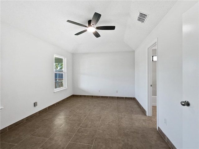 2613 Raintree Trl, Ingleside, TX 78362 - empty room with vaulted ceiling, baseboards, ceiling fan, and visible vents