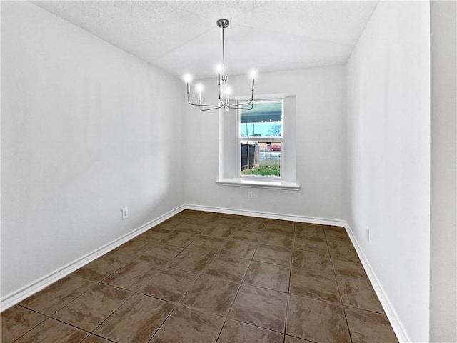 2613 Raintree Trl, Ingleside, TX 78362 - unfurnished dining area featuring baseboards, a textured ceiling, an inviting chandelier, and tile patterned flooring