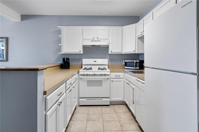 kitchen featuring white appliances, white cabinets, and under cabinet range hood