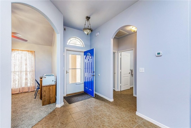 entryway with plenty of natural light and tile patterned flooring