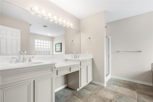 bathroom featuring vanity and a shower with door