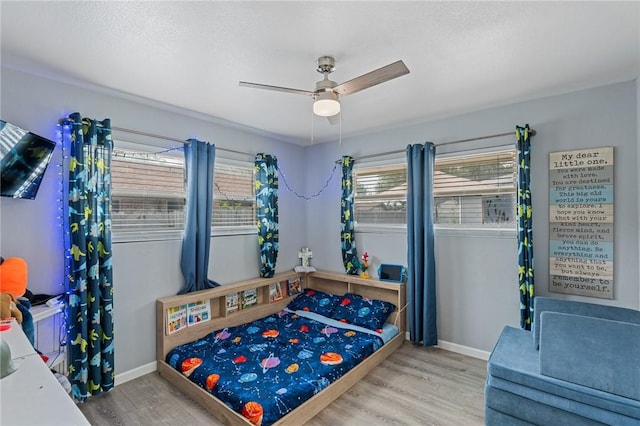 116 Daniel Moore St, Portland, TX 78374 - bedroom with wood finished floors, baseboards, and ceiling fan