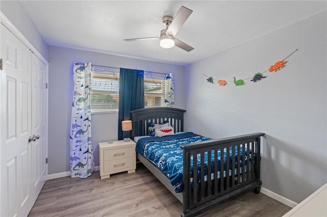 116 Daniel Moore St, Portland, TX 78374 - bedroom with wood finished floors, baseboards, a closet, and ceiling fan