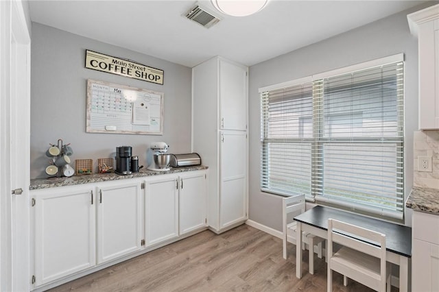 116 Daniel Moore St, Portland, TX 78374 - kitchen featuring white cabinets and light wood-style floors