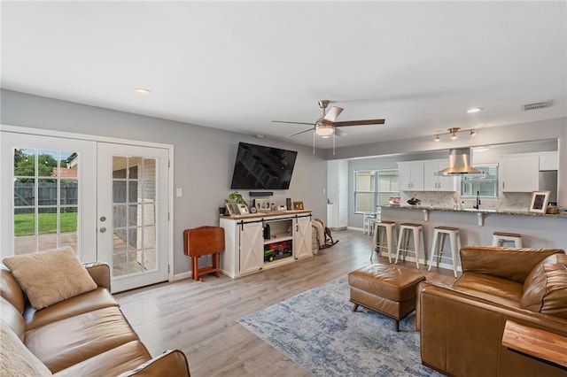 116 Daniel Moore St, Portland, TX 78374 - living area with ceiling fan, baseboards, recessed lighting, light wood-style floors, and french doors