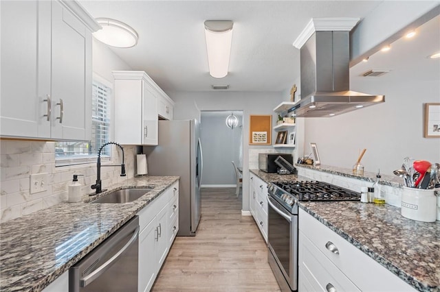 116 Daniel Moore St, Portland, TX 78374 - kitchen with stainless steel appliances, a sink, island range hood, light wood-style flooring, and white cabinets