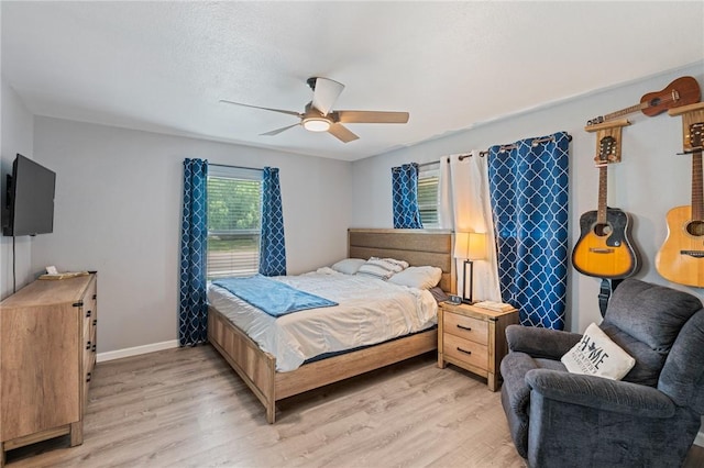 116 Daniel Moore St, Portland, TX 78374 - bedroom with light wood-style floors, baseboards, and ceiling fan