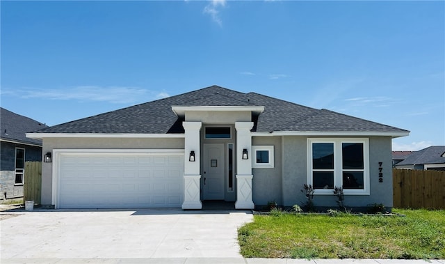 7722 Nadia Dr, Corpus Christi, TX 78414 - view of front facade with a shingled roof, an attached garage, stucco siding, and concrete driveway