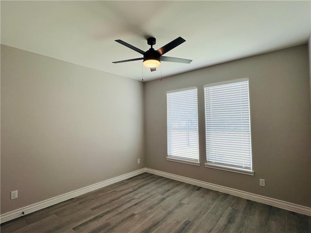 7722 Nadia Dr, Corpus Christi, TX 78414 - unfurnished room with baseboards, dark wood finished floors, and a ceiling fan