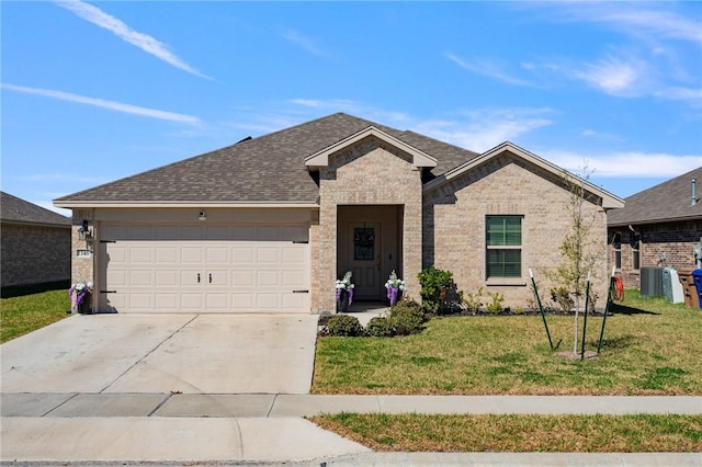 ranch-style home featuring brick siding, a shingled roof, concrete driveway, a garage, and a front lawn