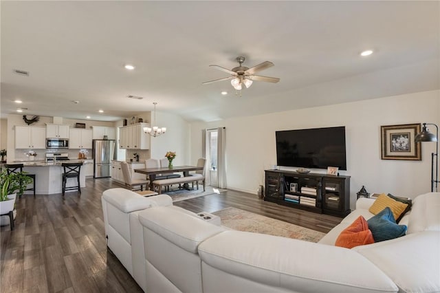 living area featuring dark wood-style floors, visible vents, and recessed lighting