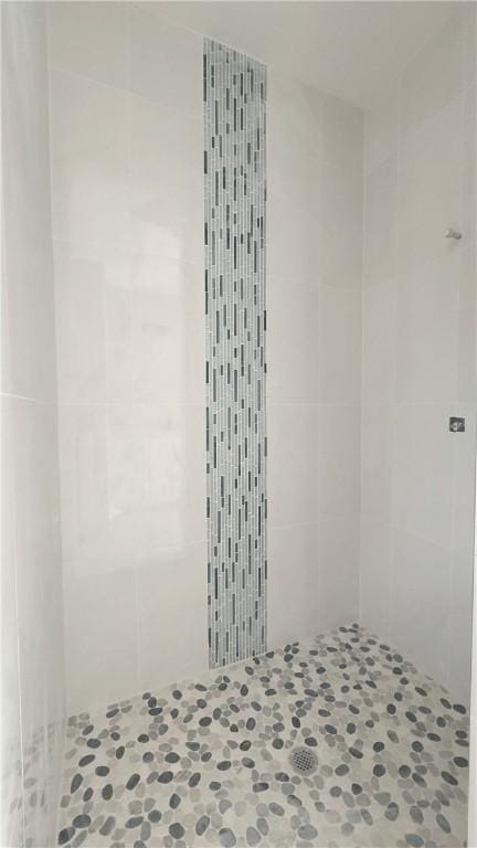 bathroom with a shower stall