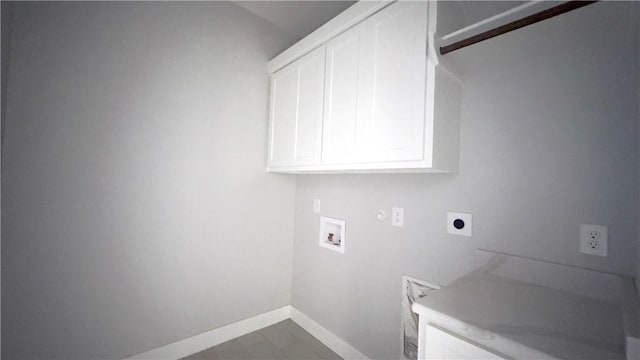 laundry room featuring baseboards, cabinet space, hookup for an electric dryer, and washer hookup