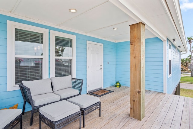 wooden deck with outdoor lounge area