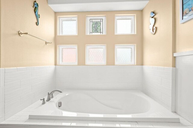 bathroom with a garden tub