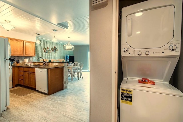 7477 State Highway 361 Unit 107, Port Aransas, TX 78373 - laundry area with stacked washer / dryer