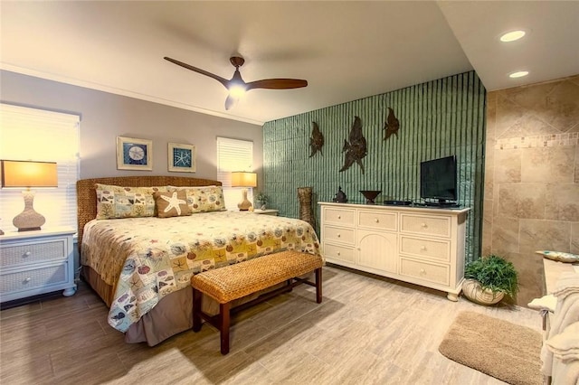 7477 State Highway 361 Unit 107, Port Aransas, TX 78373 - bedroom with wood finished floors, recessed lighting, ceiling fan, and crown molding