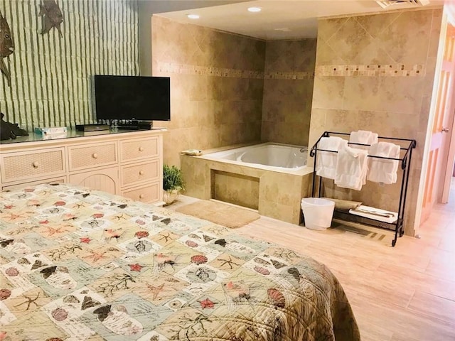 7477 State Highway 361 Unit 107, Port Aransas, TX 78373 - bedroom with tile walls and recessed lighting