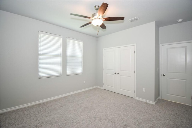 3002 N Oso Pkwy, Corpus Christi, TX 78414 - unfurnished bedroom with carpet, a closet, baseboards, and a ceiling fan