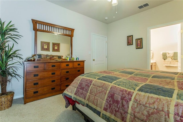 carpeted bedroom with ceiling fan and connected bathroom