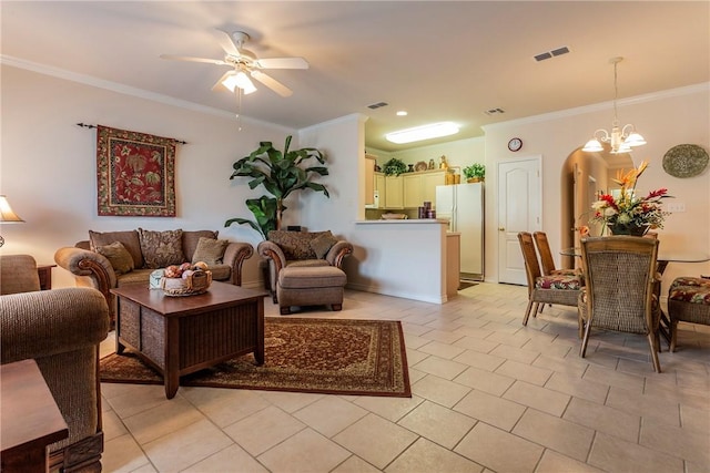 living room with light tile patterned floors, ceiling fan with notable chandelier, and ornamental molding