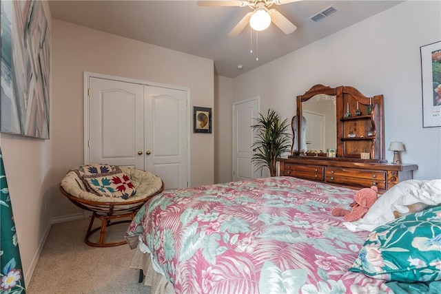 carpeted bedroom with a closet and ceiling fan