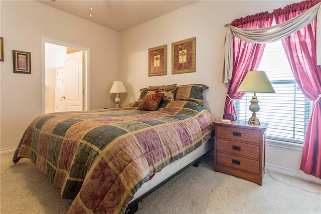 bedroom featuring light carpet