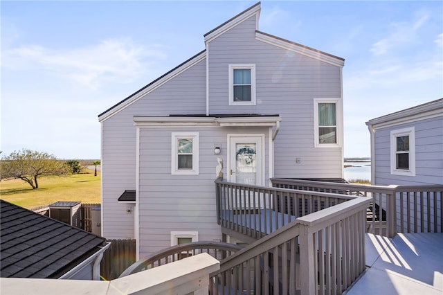 back of house featuring a wooden deck