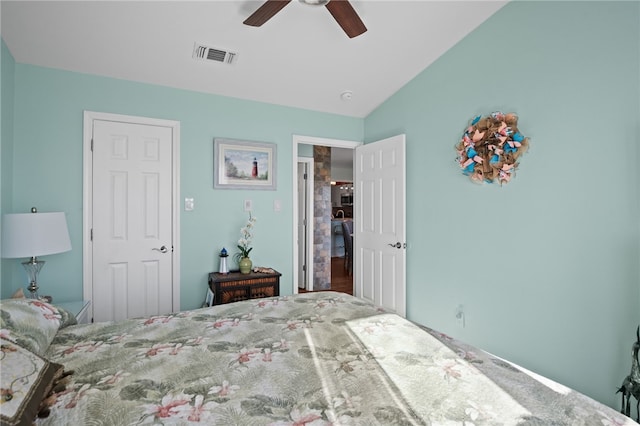 bedroom with ceiling fan and vaulted ceiling