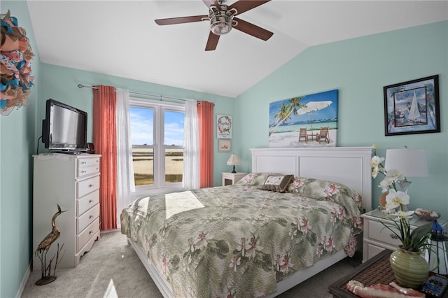 carpeted bedroom with ceiling fan and lofted ceiling