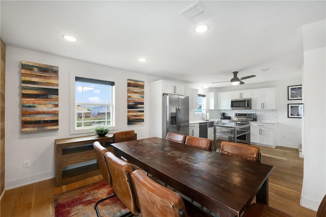 500 Royal Palm Ln, Port Aransas, TX 78373 - dining room featuring a ceiling fan, light wood-style floors, baseboards, and recessed lighting